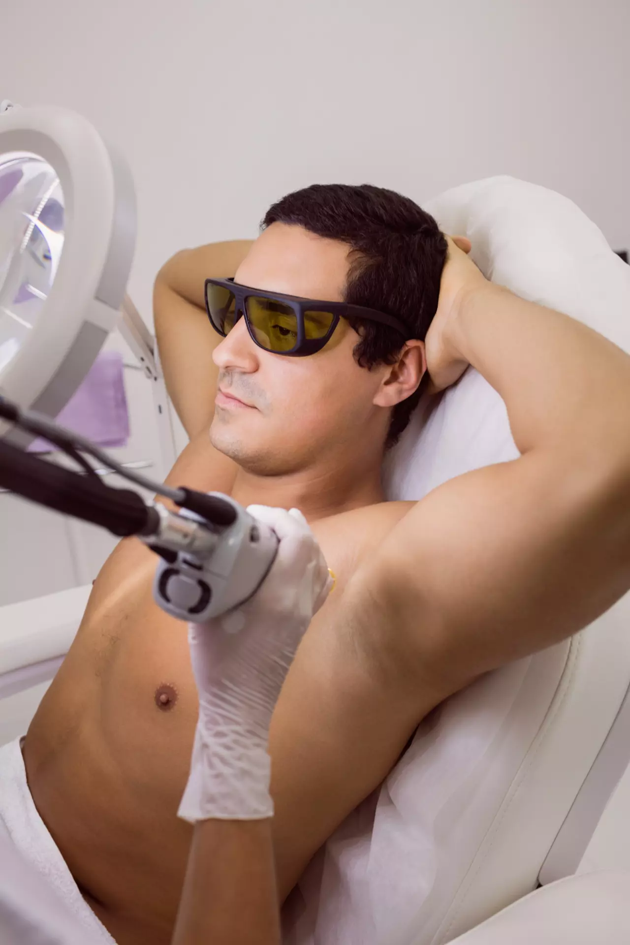 Man receiving laser hair removal